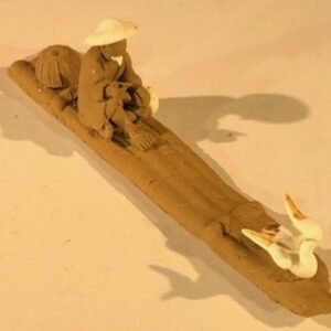 Miniature Ceramic FigurineMud Man Riding On Raft With Ducks1"